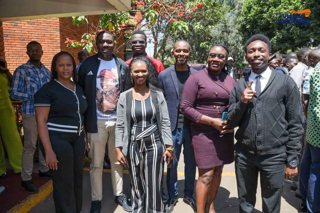 Group photo of team members dressed smartly