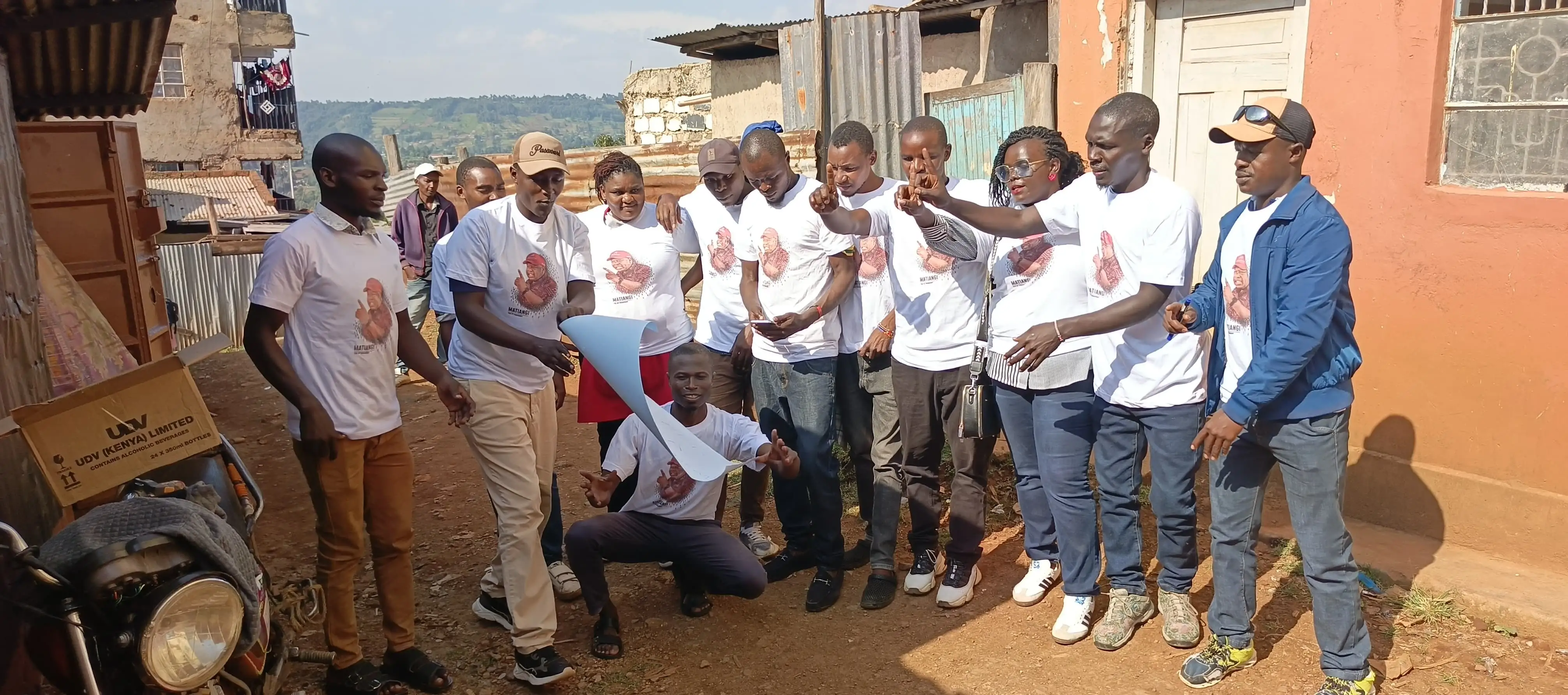 Team in white tees cheering together