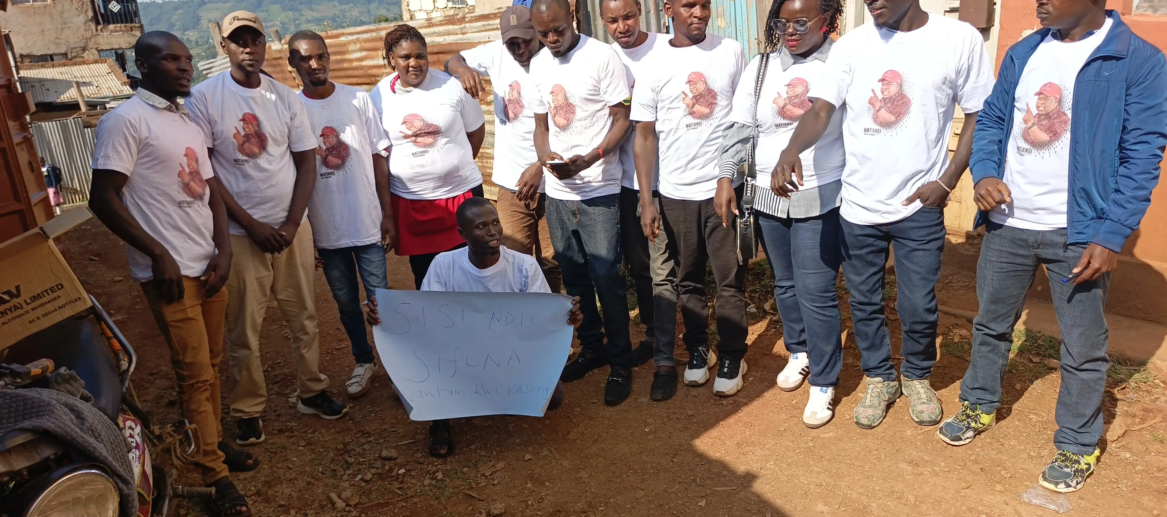 Team lined up in matching white tees